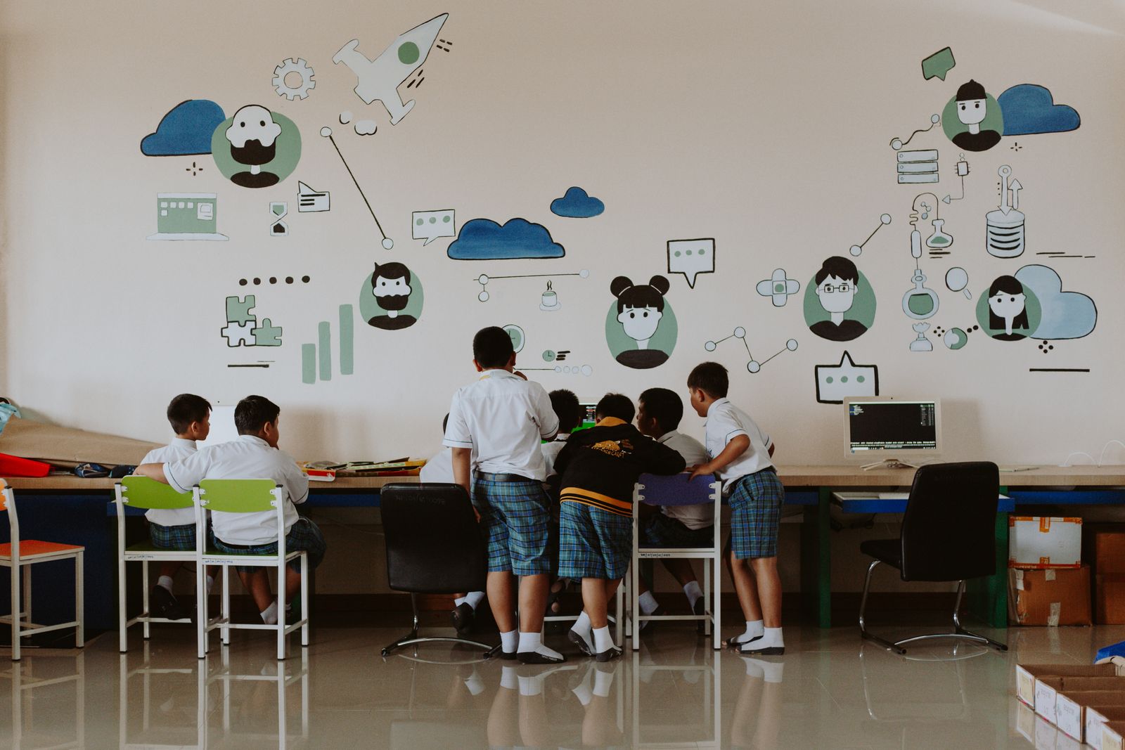 Children working at desktop computers during a lesson in the school computer lab.